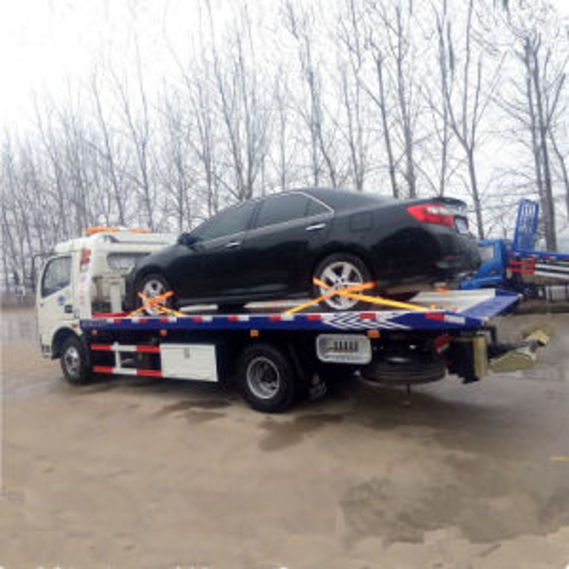 Sedan winched on by Cheap Buffalo Towing, Depew